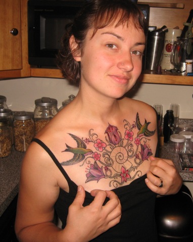 Tattoo On Breast Pictures. Female Breast Tattoo Design
